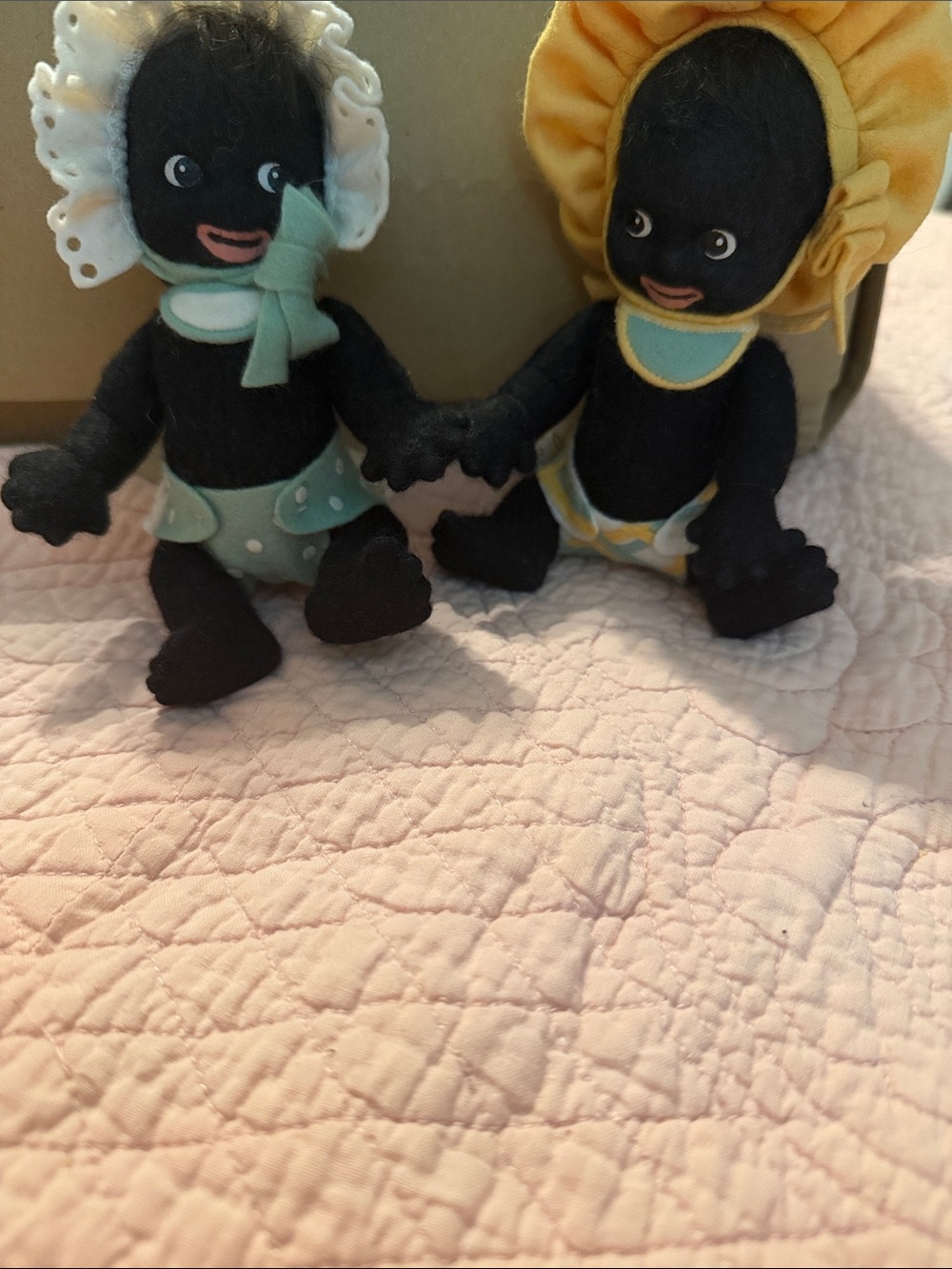 Set of Two Black Plush Baby Dolls with Yellow and Mint Hats